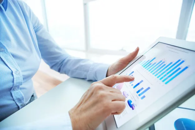 Man working on charts on a tablet