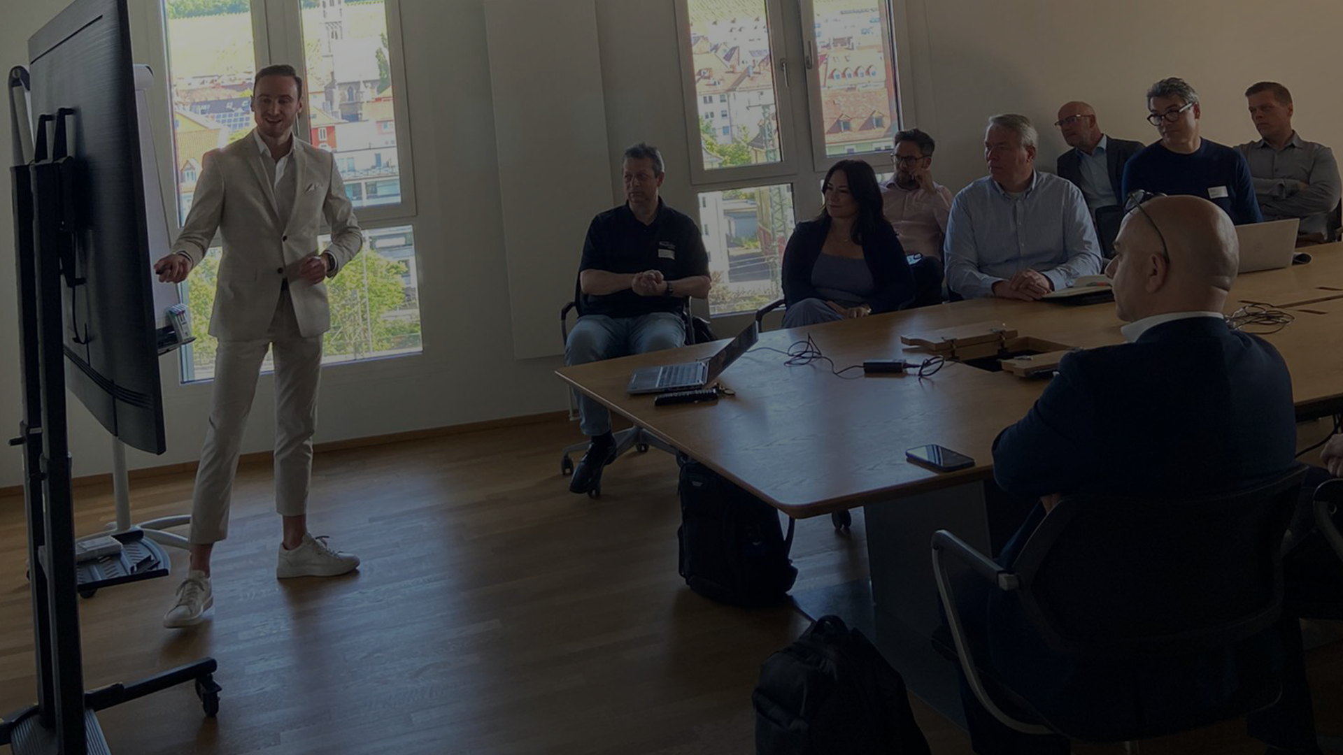 Business presentation in a meeting room with a male presenter.