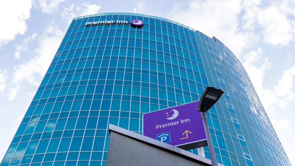 Premier Inn hotel with reflective glass facade and signage.