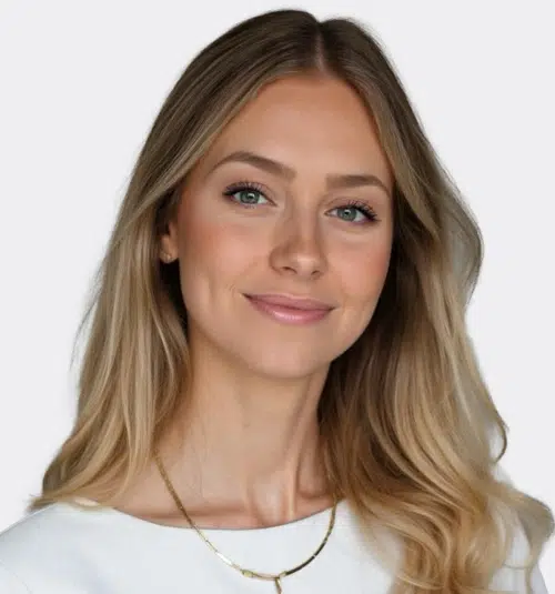 Woman with long blonde hair and a white top