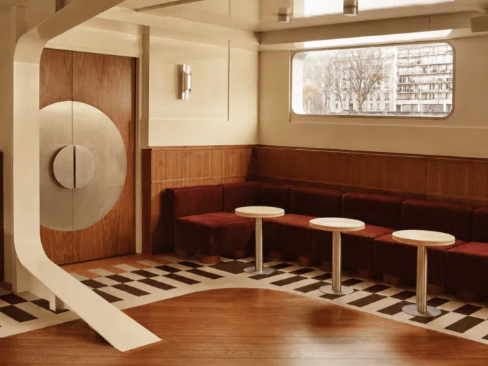 Stylish interior with round tables and modern furniture designs.